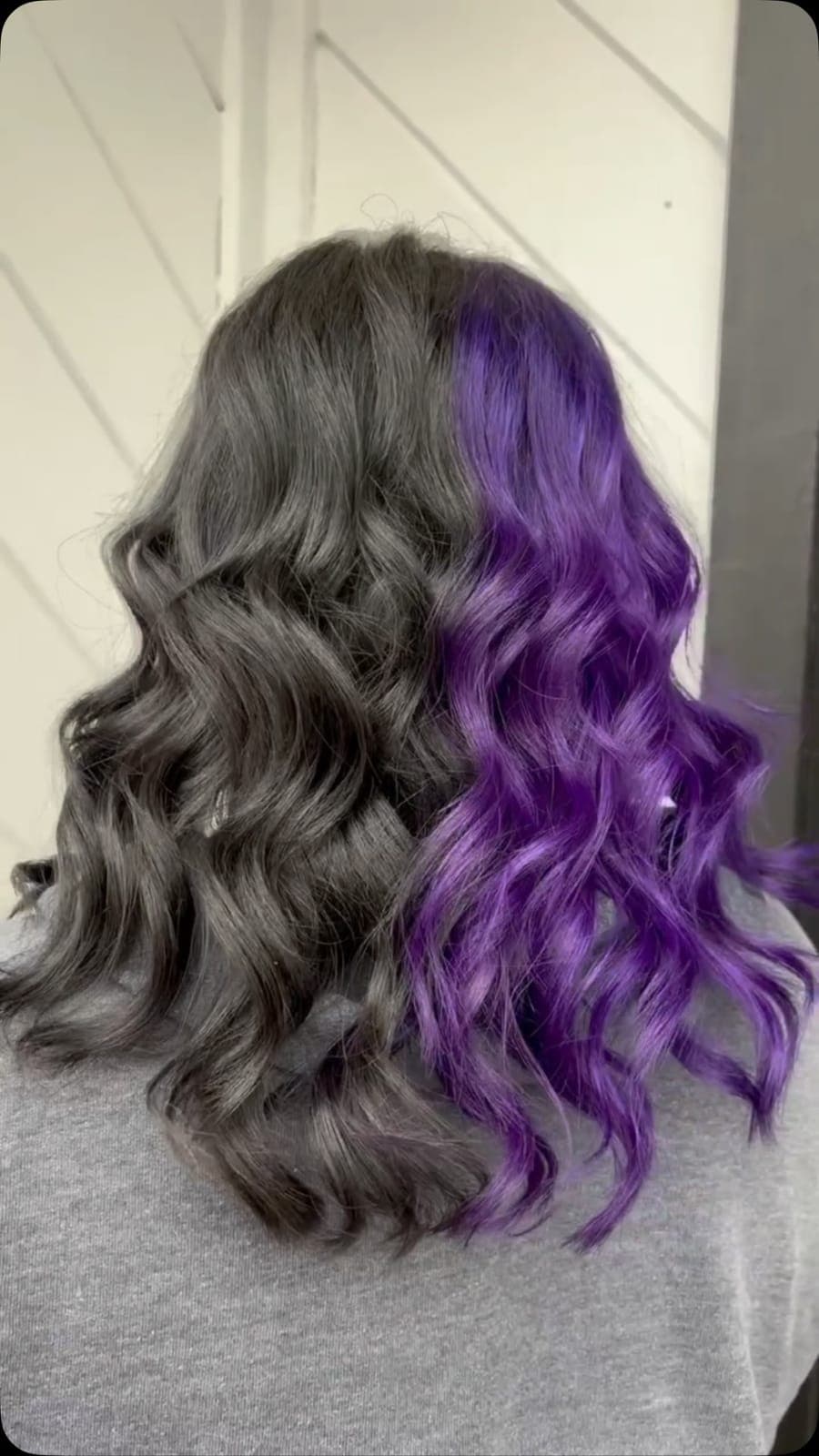 Split dye: half black, half purple waves