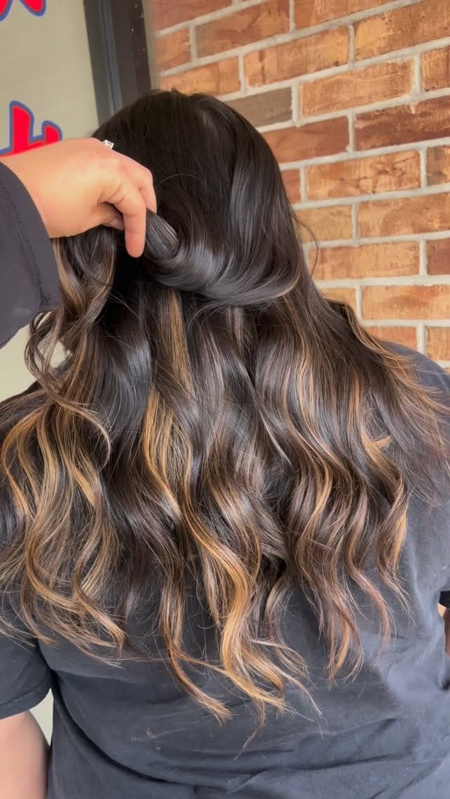 Soft caramel balayage on long waves
