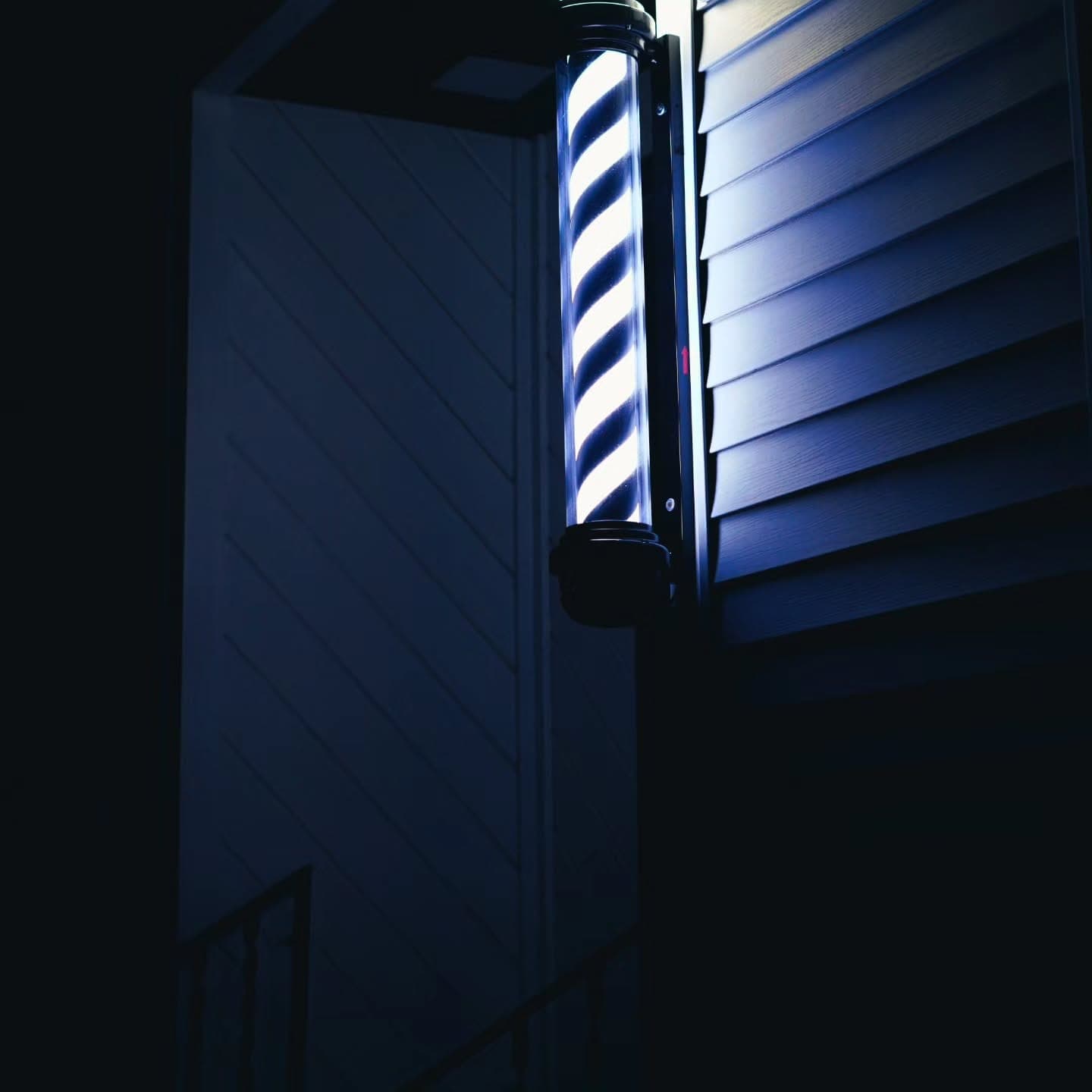 Barber pole at night