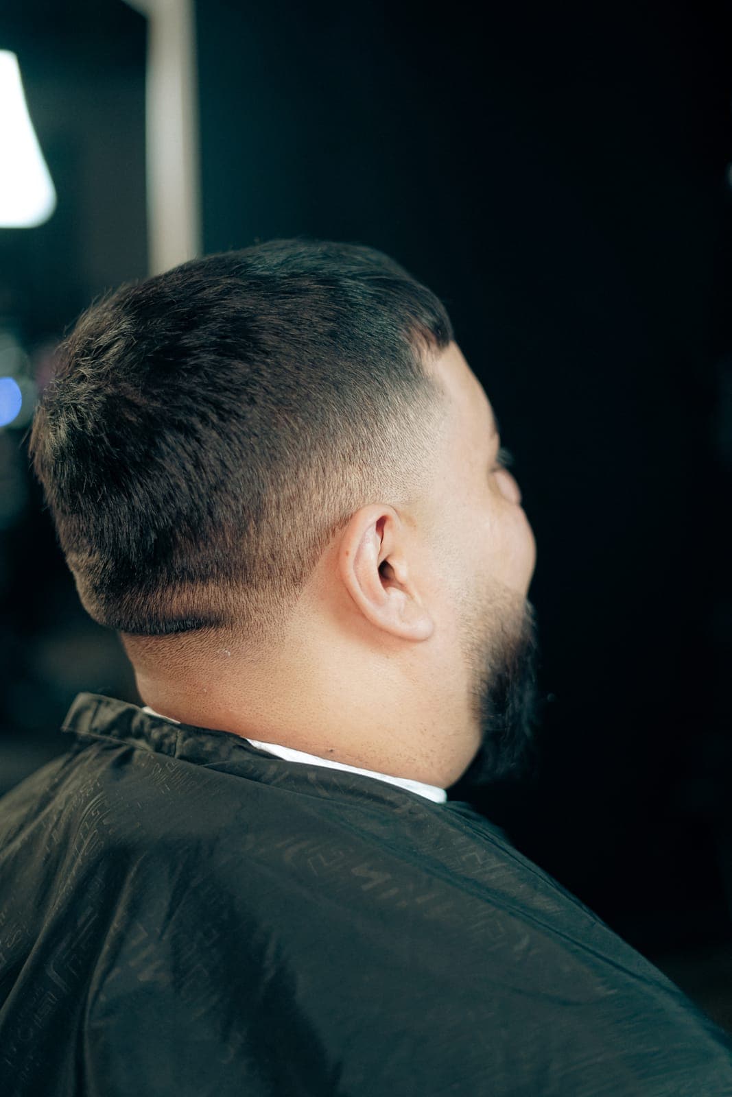 Mid fade blended into a beard